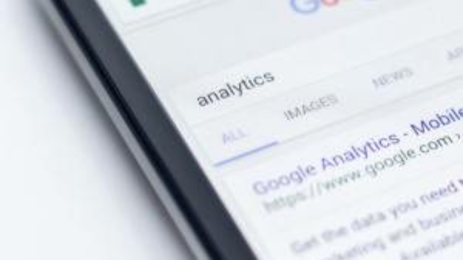 Image of a phone showing a Google search for the keyword 'analytics'