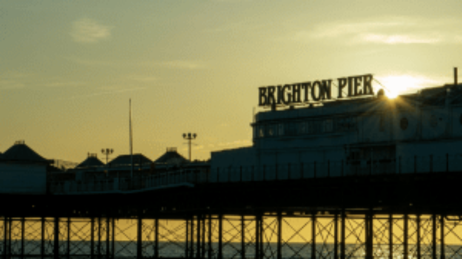 Photograph of Brighton Pier framed by the sea