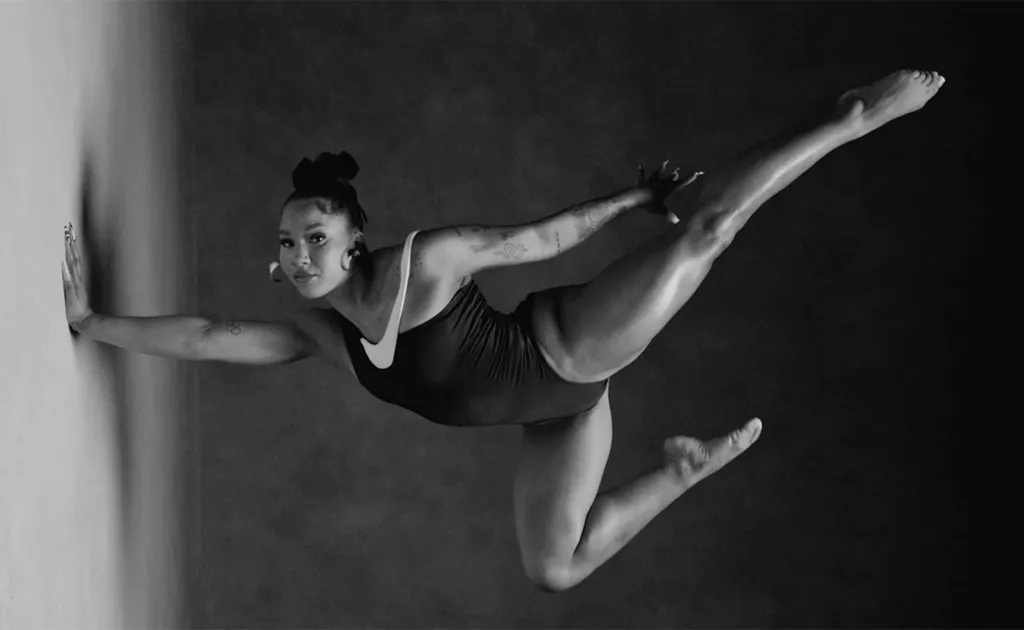 Olympic athlete Jordan Chiles performing a gymnastics stunt. 